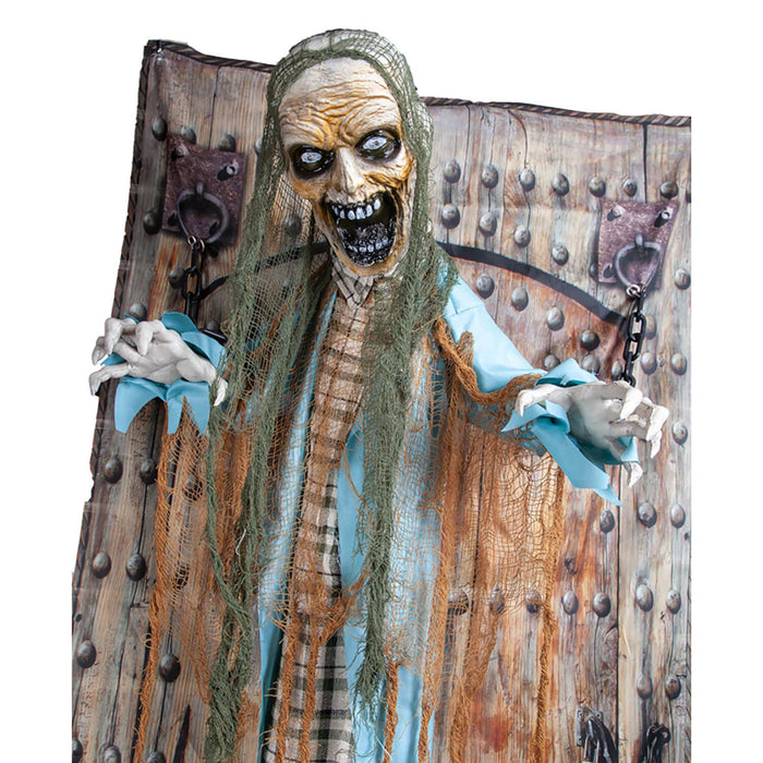 Screaming Zombie figure figure skelton hands chained to a prison door