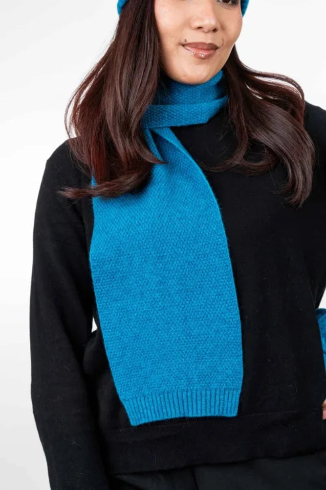 Possum and Merino TR100 Moss Stitch Scarf - A plain scarf using moss stitch. Makes a set with TR49 Plain Gloves and TR200 Moss Stitch Beanie. One Size Only – Approx. 19cm wide x 157cm long Made proudly in New Zealand from a luxurious blend of 25% possum fur, 65% merino & 10% silk.