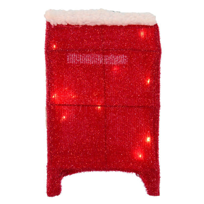 Back of a red tinsel coloured post box with fleece snow top