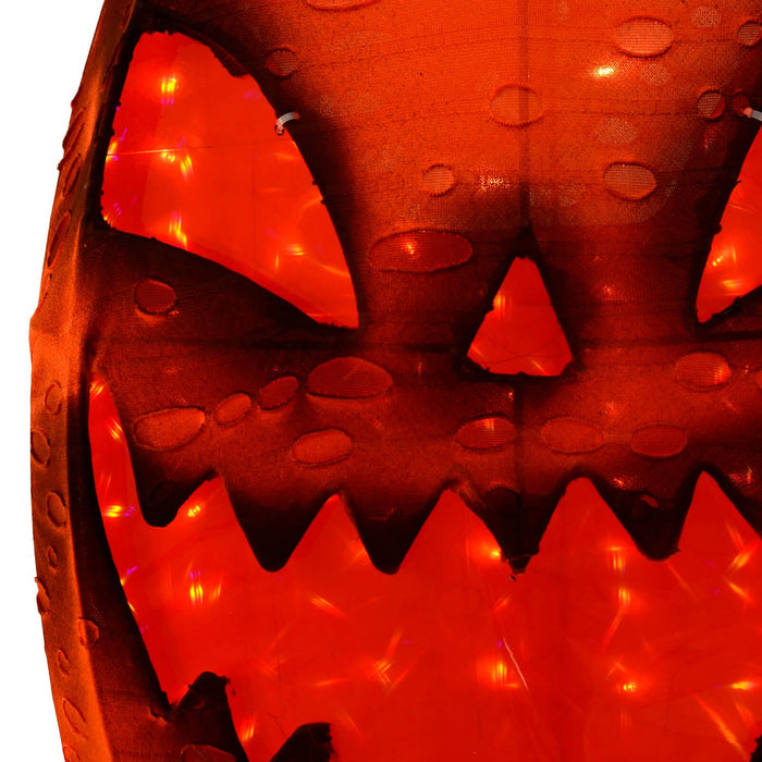 Close up of the lights in an orange LED pumpkin garden decoration