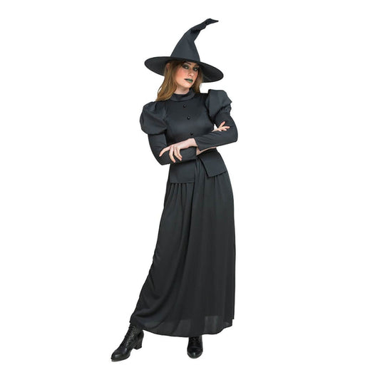 Woman wearing a black witch costume with long dress and pointed hat