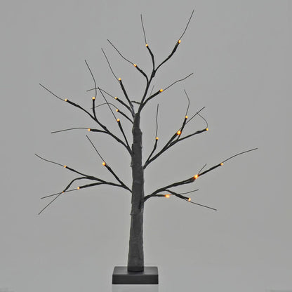 Halloween black twig tree lit up with orange lights