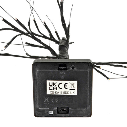 Battery compartment on the base of a black twig tree