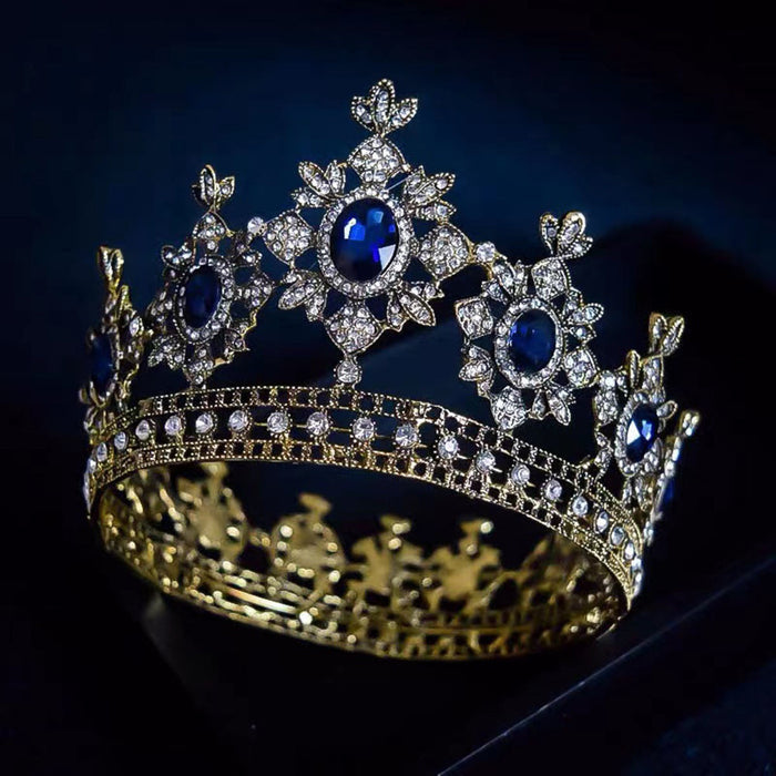 golden crown has thick metal construction, large, brilliant imitation sapphires and hundreds of imitation diamonds