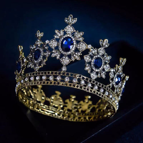golden crown has thick metal construction, large, brilliant imitation sapphires and hundreds of imitation diamonds