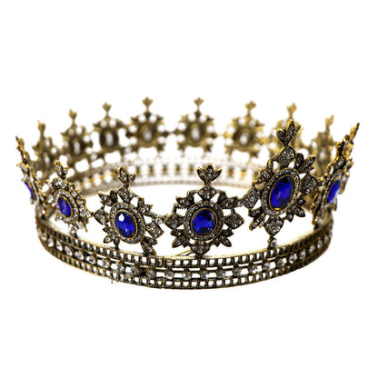 golden crown has thick metal construction, large, brilliant imitation sapphires and hundreds of imitation diamonds