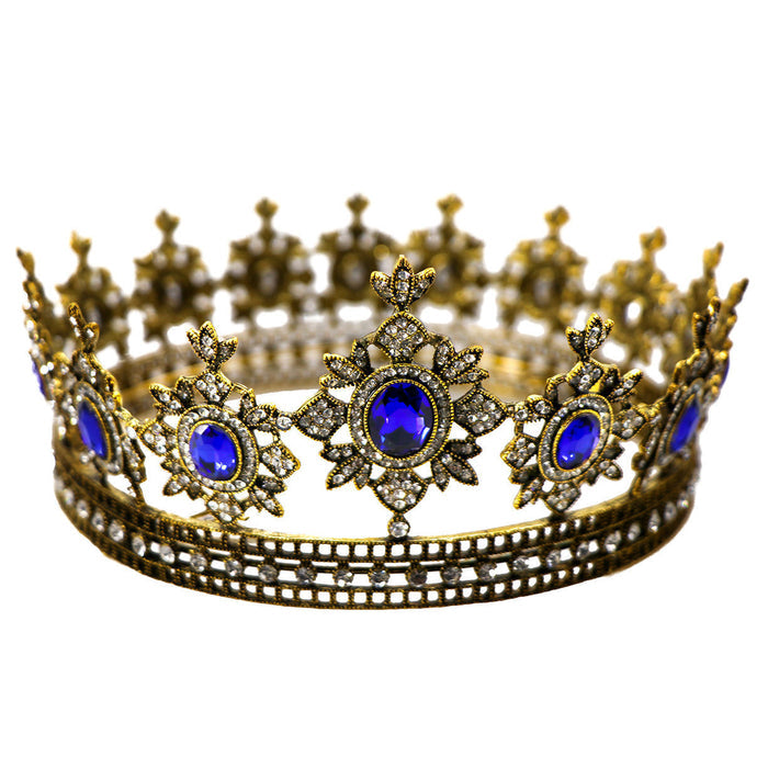 golden crown has thick metal construction, large, brilliant imitation sapphires and hundreds of imitation diamonds