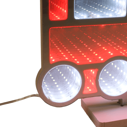 Close-up of train'ss red and white lights on a white background with wire