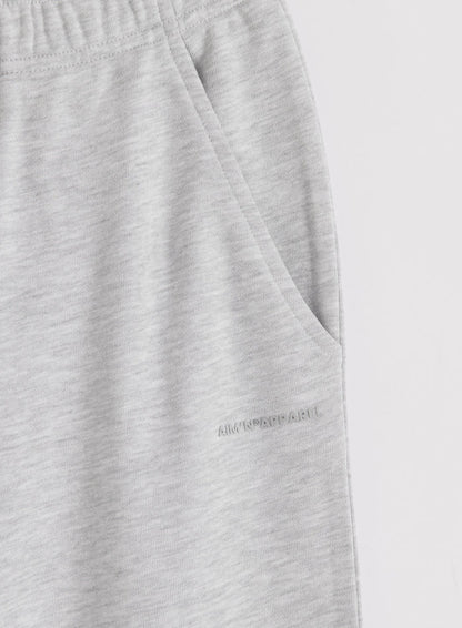 Vaaleanharmaat meleeratut aim'n Chunky Terry Sweatpants -housut sivutaskulla ja sävy sävyyn -logolla.