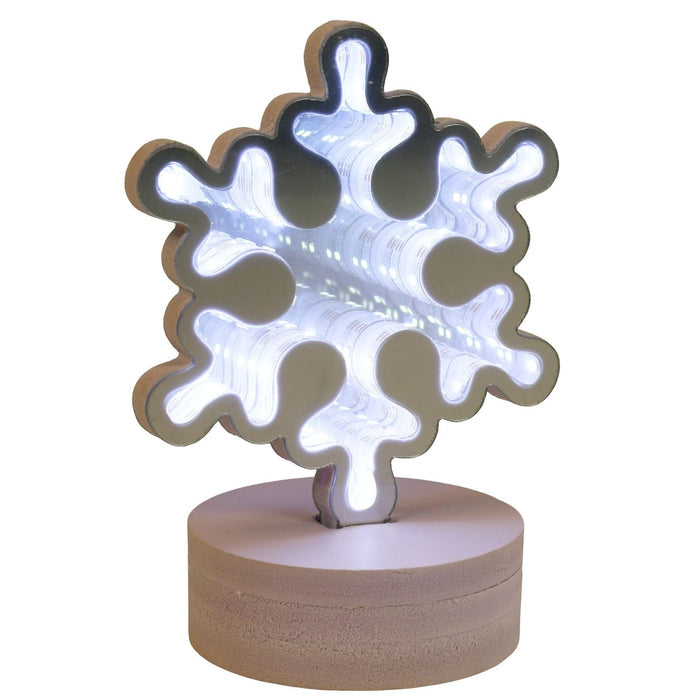 Snowflake-shaped night light on a white background
