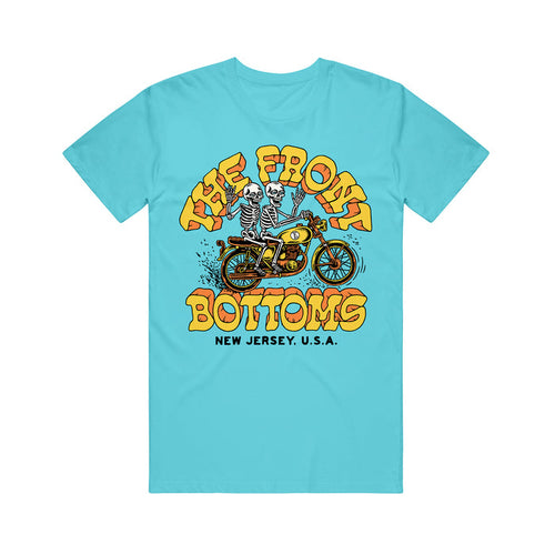 A Lagoon Blue T-Shirt from The Front Bottoms features a cartoon skeleton on a yellow motorcycle, bold yellow "The Front Bottoms," and "New Jersey, U.S.A." below—a must-have for fans.