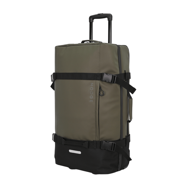 side view of large hodge and hodge safari suitcase with telescopic handle, rounded zip pulls and stylish security buckles