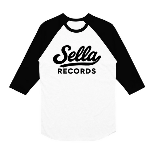 A white and black raglan-sleeve baseball shirt from The Front Bottoms, featuring "Sella RECORDS" in bold black letters on the front. Available for presale with preorder shipping starting 04/03/26.