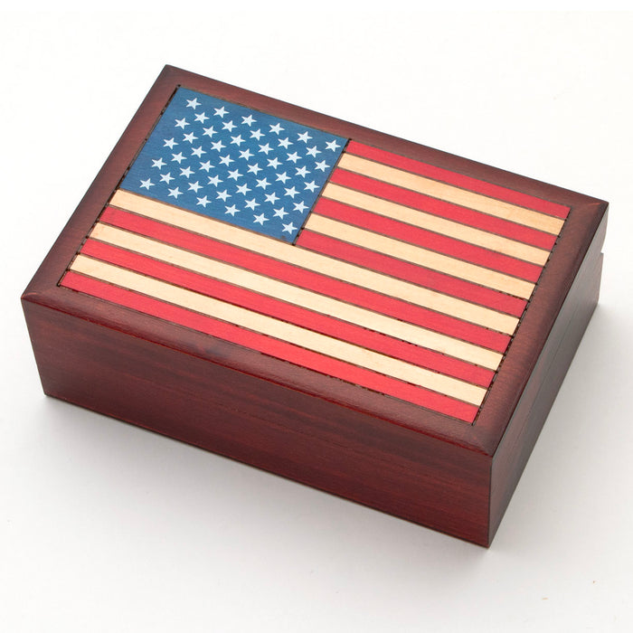 handcrafted wooden box features an American Flag on top. Hinged lid, lined with velvet inside on the bottom